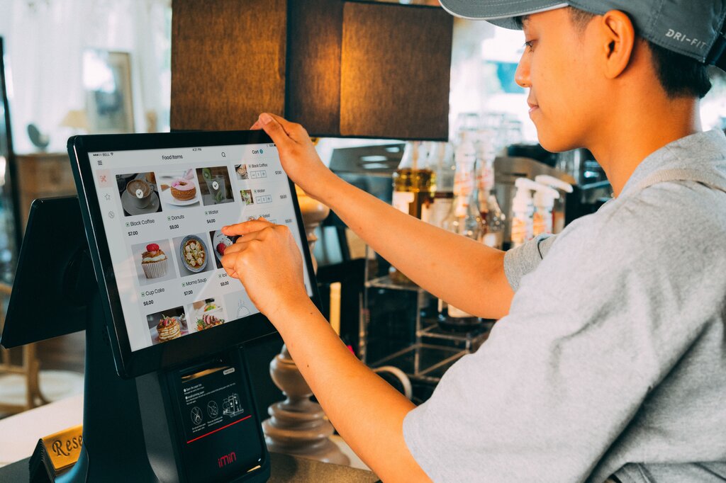 A RESTAURANT 'CASHIER' IS A PERSON WHO...