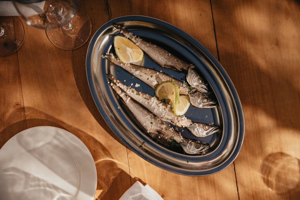 It preserves fish by soaking in a brine, a combination of salt and vinegar