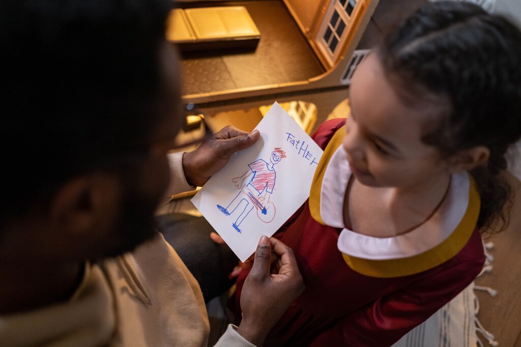 Clara showed her drawing to her brother. She waited for him to say something. He looked at it for a moment and said, “That's… interesting.” Clara quickly took the drawing back and put it inside her notebook.