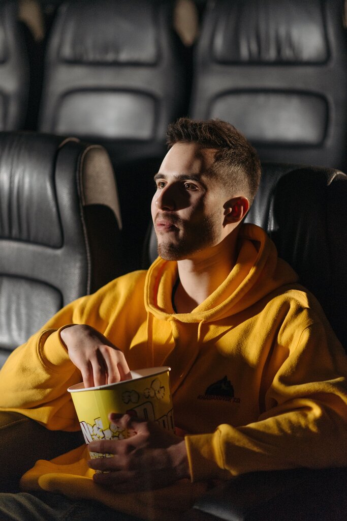 Ethan arrived at the movie theater early. He bought popcorn and found his seat. Every few minutes, he looked toward the entrance. When the lights began to dim, he checked his phone again and sighed.
