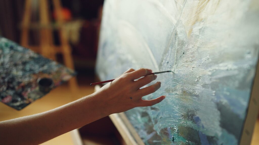 You paint pictures in ______