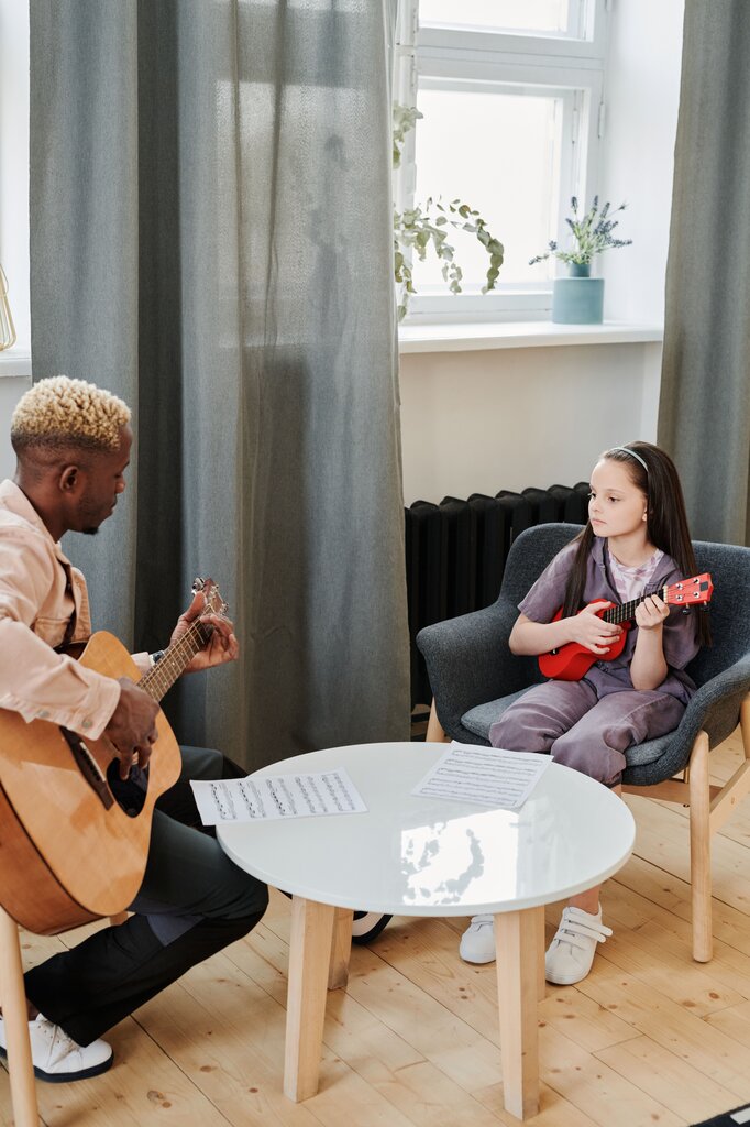 You learn how to play the guitar in _______.