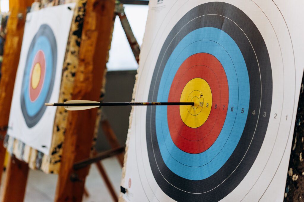 Type of game where players aim to send an object toward a specific target to score points based on accuracy and precision.