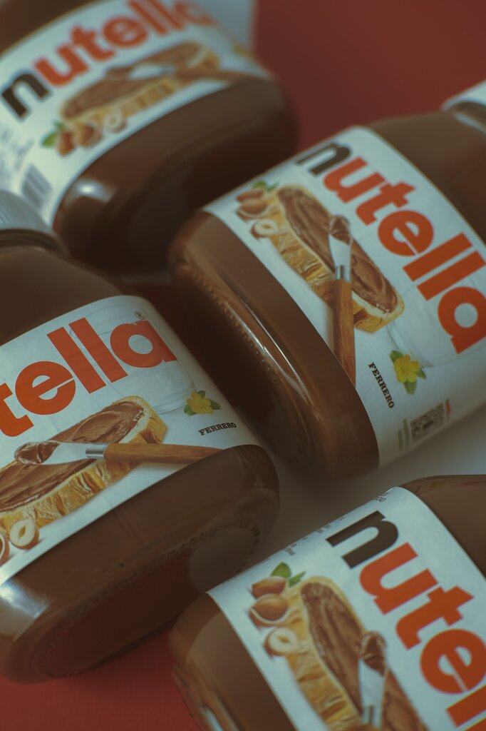 Why do Nutella jars come in so many quirky sizes and even glasses-as-jars in Europe?