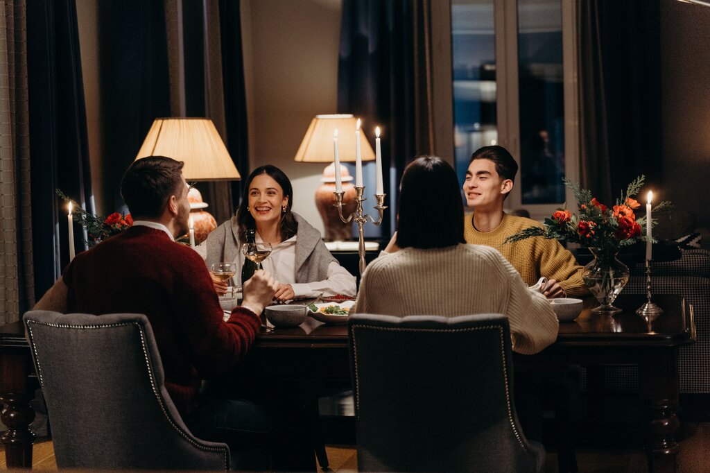 By the time you arrive, we ______ dinner.