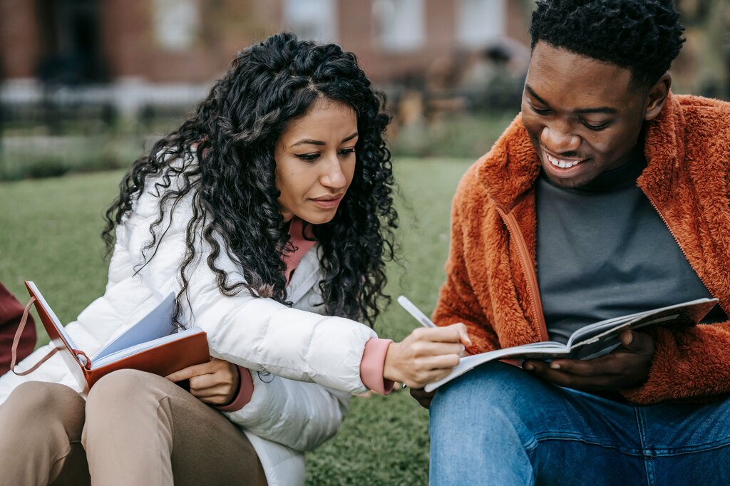 He suggested that she ______ more careful with her assignments.