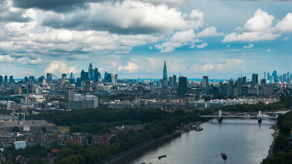 She said she ______ to London the following week.