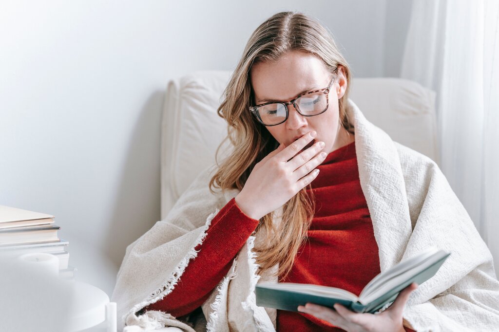 A person yawns with a heavy body posture. Which feeling is indicated?