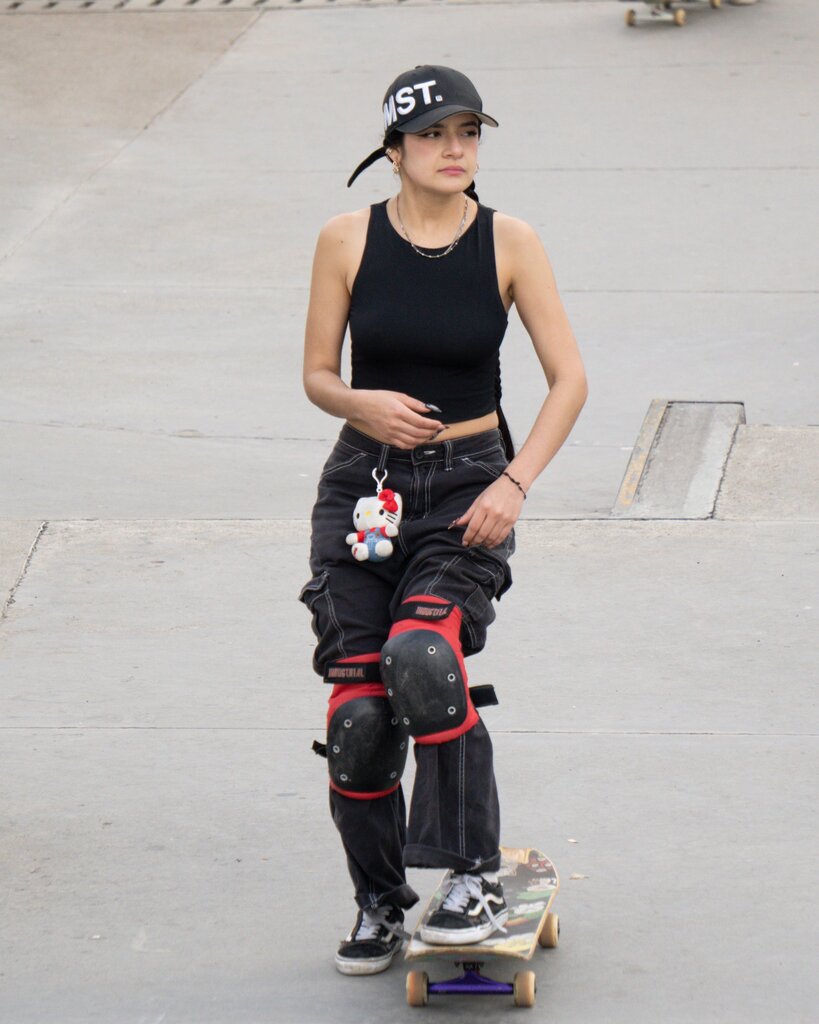 She fell off her skateboard and hurt her knee.