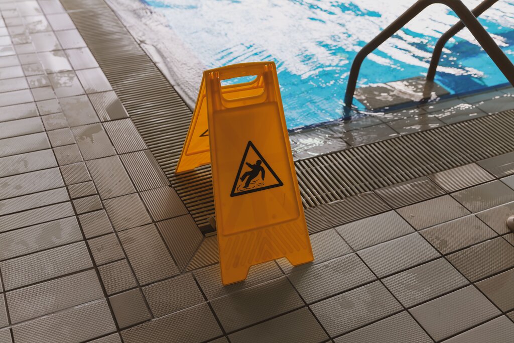 He slipped on the wet floor.
