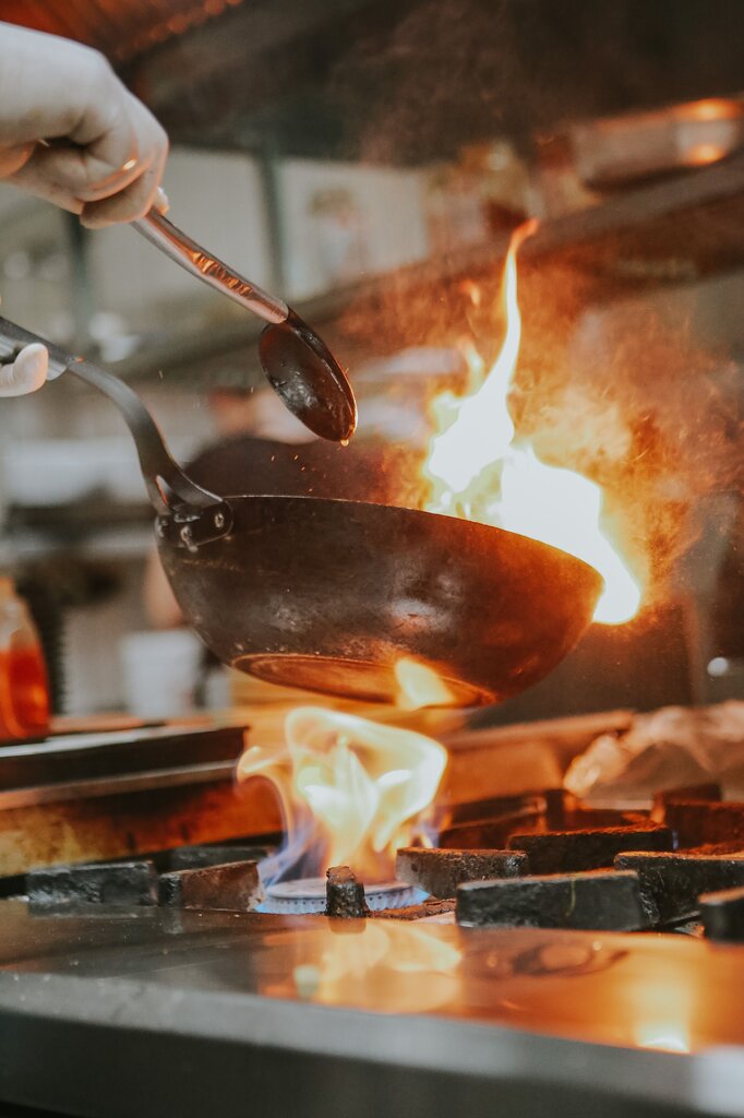 She burned her hand on the hot stove.